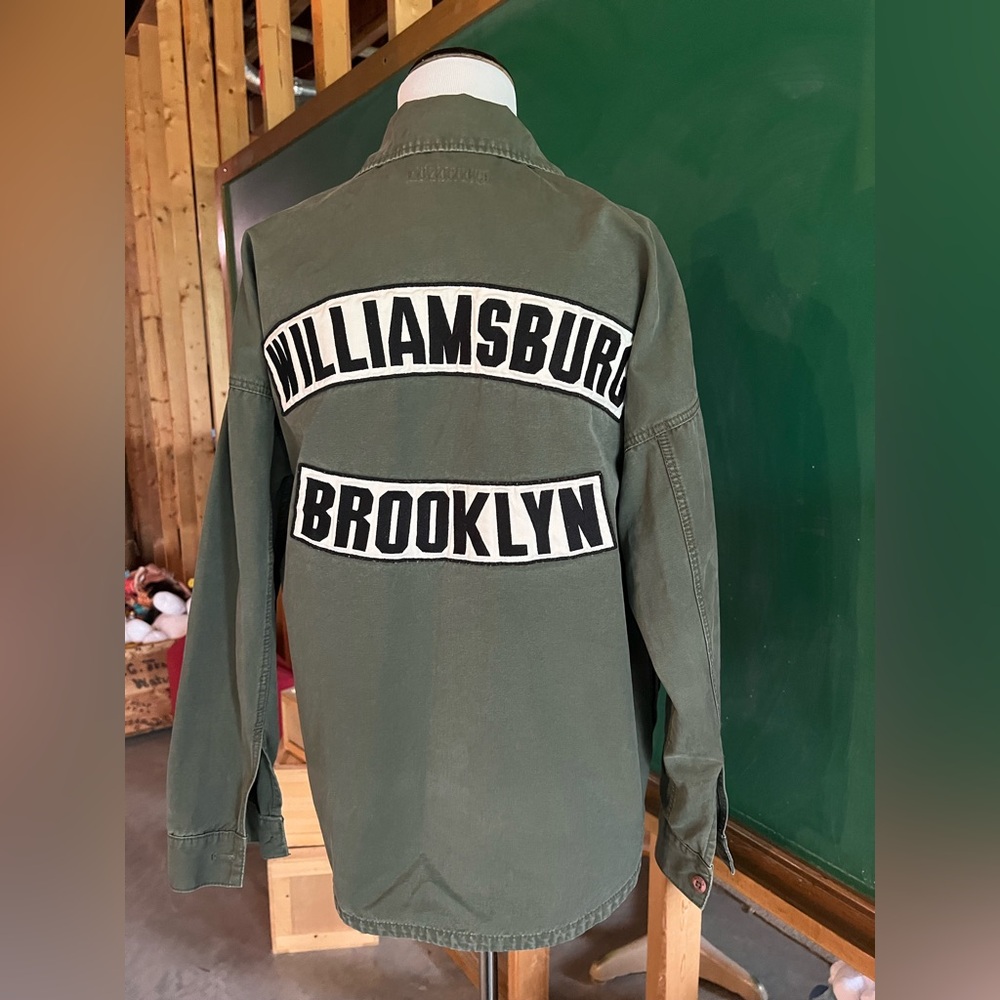 Moussy brand field jacket. No size listed. Army green.